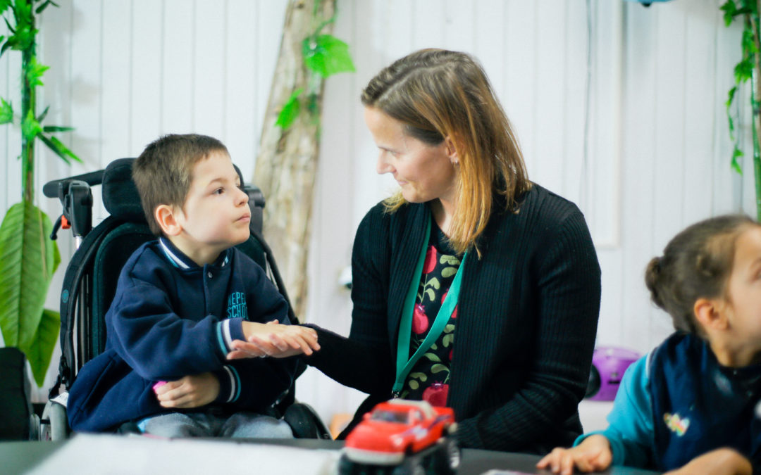 teacher communicating with student with disability